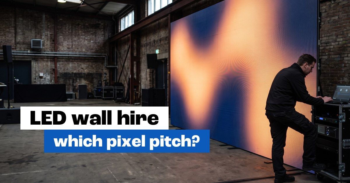 Technician building a large LED wall in an industrial event hall: LED wall hire with the right pixel pitch