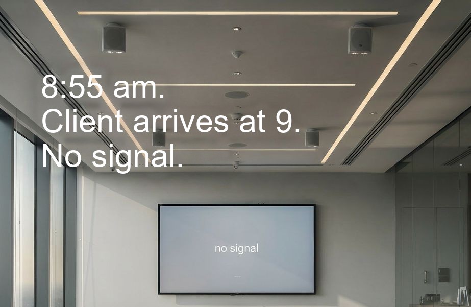 Empty meeting room with a screen showing no signal