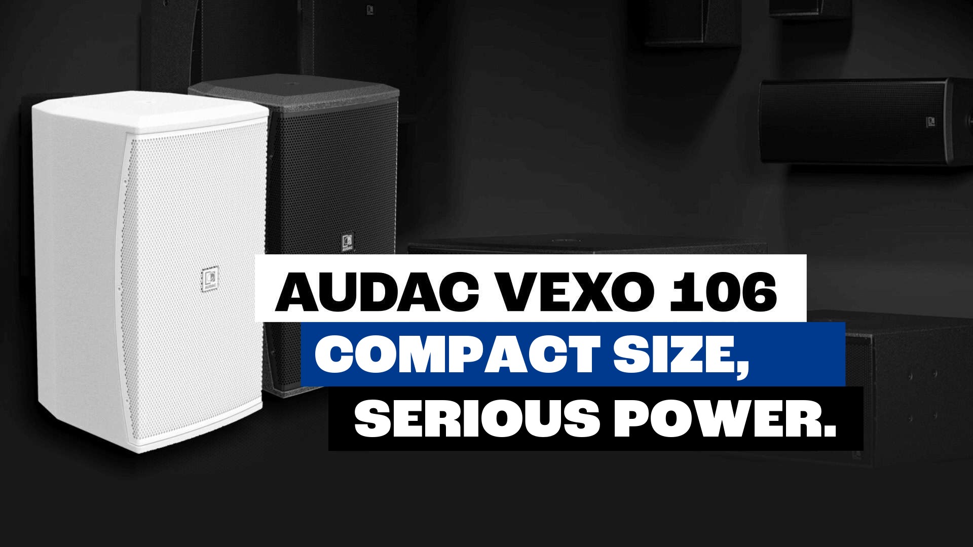 White and black AUDAC VEXO 106 loudspeakers against a dark background